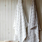 LAPUAN - PAUSSI - LINEN HAND TOWEL. WHITE + GREY